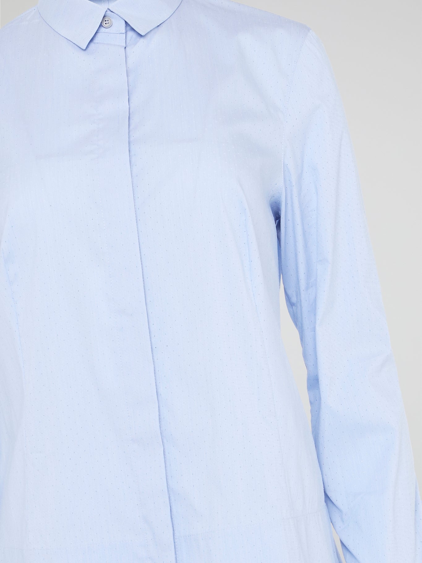 Introducing the Powder Blue High-Low Shirt by Akris Punto, where elegance meets contemporary style. Delicate powder blue hue cascades down the front, enveloping you in a calming wave of tranquility. With its unique high-low hemline and luxurious fabric, this shirt effortlessly elevates any outfit, making it a must-have piece for the fashion-forward trendsetters.