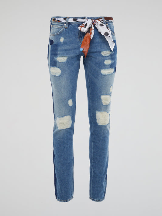 Wrap yourself in urban-chic style with our Scarf Belted Distressed Denim Jeans by Roberto Cavalli. The statement scarf belt adds a touch of bohemian flair to these edgy jeans, perfect for the fashion-forward individual. Stand out from the crowd and make a lasting impression with this unique and personal denim piece.