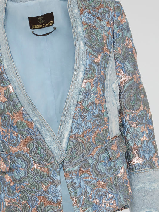 Elevate your street style with the stunning Foliage Embroidered Denim Blazer by Roberto Cavalli - a bold and unique statement piece that will set you apart from the crowd. Made with the highest quality denim and featuring intricate foliage embroidery, this blazer is a true work of art that exudes luxury and sophistication. Stand out in any crowd and turn heads wherever you go with this eye-catching and one-of-a-kind blazer from Roberto Cavalli.