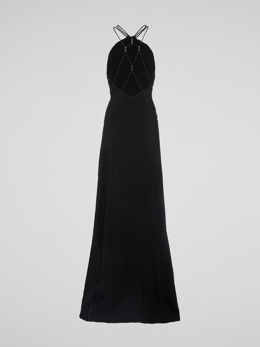 Transport yourself to the ultimate glamorous oasis with this stunning Black Halter Neck Maxi Dress from Roberto Cavalli. Crafted with luxurious materials and featuring a flattering halter neck design, this dress is guaranteed to turn heads at any event. Add a touch of elegance and sophistication to your wardrobe with this show-stopping piece that will make you feel like a true fashion icon.