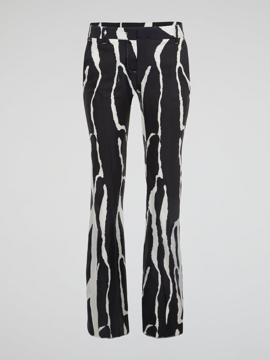 Unleash your wild side with these stunning zebra print wide leg pants from Roberto Cavalli. Made for the bold and the fearless, these pants will add a touch of exotic flair to your wardrobe. Embrace your inner fashionista and stand out from the crowd in these eye-catching statement pants.