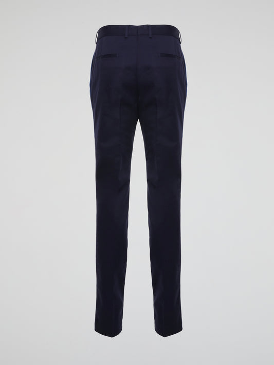 Imagine effortlessly commanding attention in any room with the sleek sophistication of these Navy Tapered Suit Pants by Roberto Cavalli. Crafted with precision and artistry, these pants exude confidence and power, making them a must-have staple for any modern gentleman's wardrobe. Elevate your style to new heights and turn heads with every stride in these statement-making trousers.