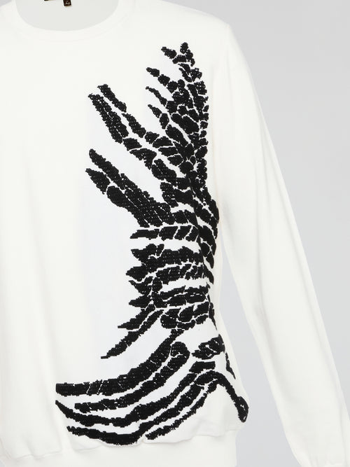 Wrap yourself in pure luxury with this exquisite white embroidered sweatshirt from Roberto Cavalli. The intricate detailing and soft fabric ensure both comfort and style, making it the perfect statement piece for any occasion. Elevate your wardrobe with this timeless and effortlessly chic addition that is sure to turn heads wherever you go.