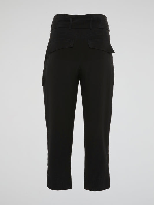 Feel fierce and fabulous in these Black Cargo Capris by Roberto Cavalli - a must-have staple for your wardrobe. The edgy cargo pockets add a unique touch to these versatile capris, perfect for any occasion. Make a statement and turn heads wherever you go with these chic and stylish capris.