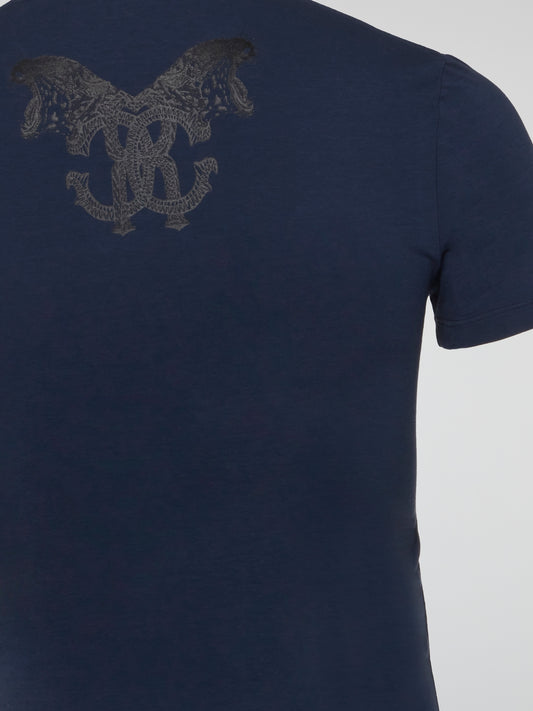 The Navy Logo Print Round Neck T-Shirt by Roberto Cavalli Underwear is a striking statement piece for anyone looking to elevate their casual wardrobe. With the iconic logo print front and center, this tee exudes luxury and style. Perfect for adding a touch of sophistication to your everyday look.