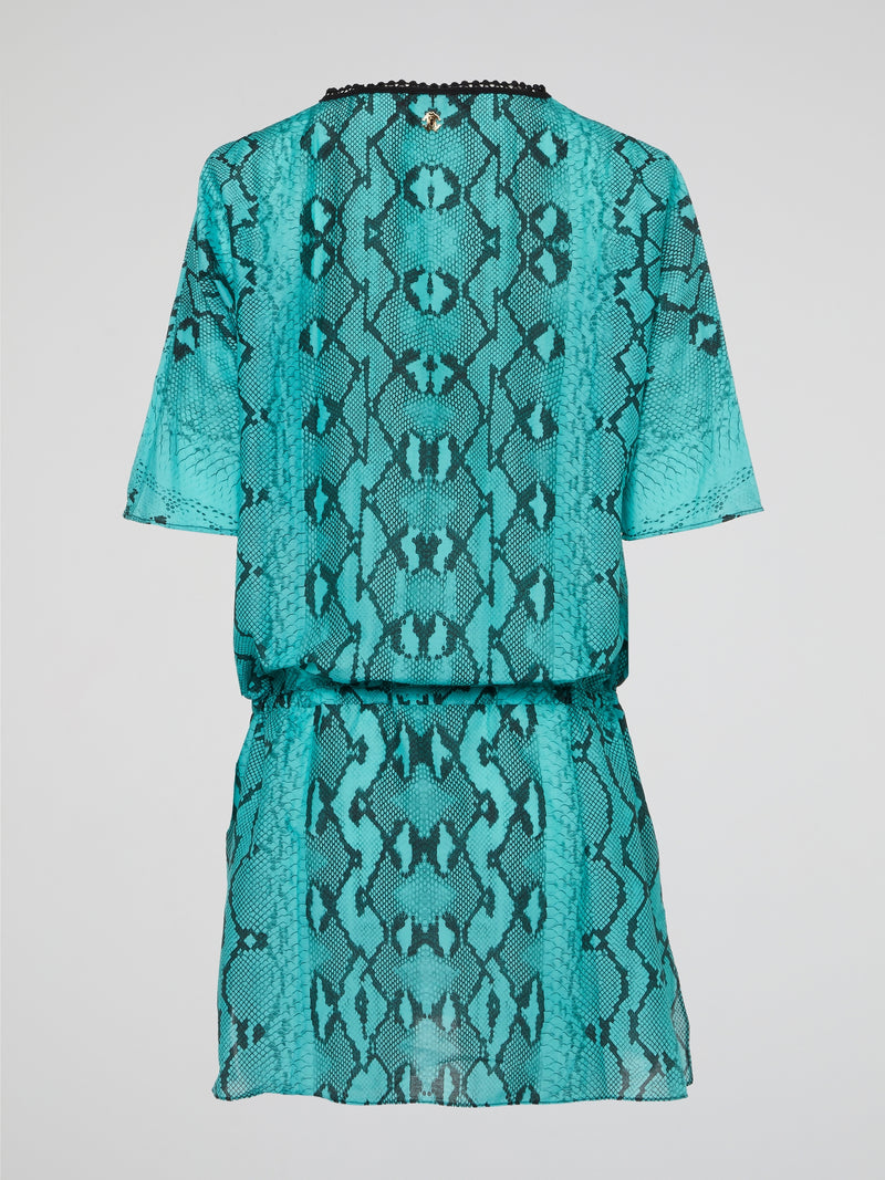 Embrace your wild side with the luxurious Green Snake Print Kaftan by Roberto Cavalli. This stunning piece will make you feel like a tropical goddess, with its flowing silhouette and eye-catching snake print design. Perfect for lounging by the pool or making a statement at a beach party, this kaftan is sure to turn heads wherever you go.