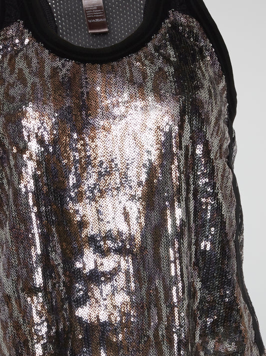 This Sleeveless Sequin Top by Roberto Cavalli is an absolute showstopper, shimmering and shining with every movement you make. The intricate sequin detailing exudes luxury and sophistication, perfect for a night out on the town. Make a statement and turn heads wherever you go with this stunning and unique piece from Roberto Cavalli.