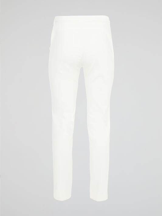 Get ready to turn heads with these stunning White Skinny Fit Trousers by Akris Punto! Designed to flatter every curve, these trousers hug your body in all the right places, giving you a sleek and elegant silhouette. Perfect for both casual and formal occasions, these versatile pants are a must-have addition to your wardrobe!