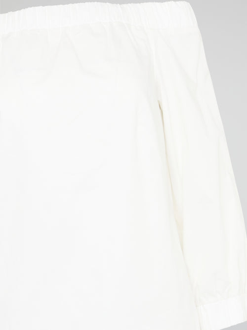 Elevate your summer wardrobe with our White Off-Shoulder Top by Akris Punto. Embrace a touch of effortless elegance as the delicate fabric gracefully drapes off your shoulders, exuding femininity and style. With its versatile design, this top is perfect for both casual outings and special occasions, ensuring you always feel chic and glamorous wherever you go.