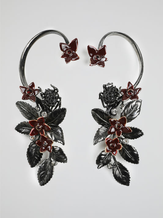 Step into a world of sheer opulence with our Crystal Embellished Floral Earrings by Roberto Cavalli. Exquisitely crafted, these earrings are a bold statement of elegance and femininity. Adorned with intricately detailed flowers and shimmering crystals, they effortlessly elevate any outfit, captivating all those who catch a glimpse.