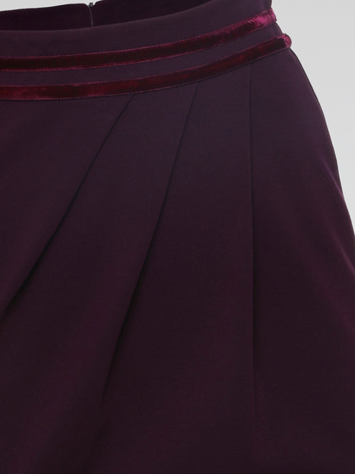 Introducing the Burgundy Draped Skirt by Roberto Cavalli, a graceful masterpiece that effortlessly captivates attention. Crafted with meticulous precision, this luxurious skirt embraces the spirit of elegance, featuring cascading layers that dance with every step. Emanate sophistication and allure as you glide across the room, leaving a trail of admiration in your wake.