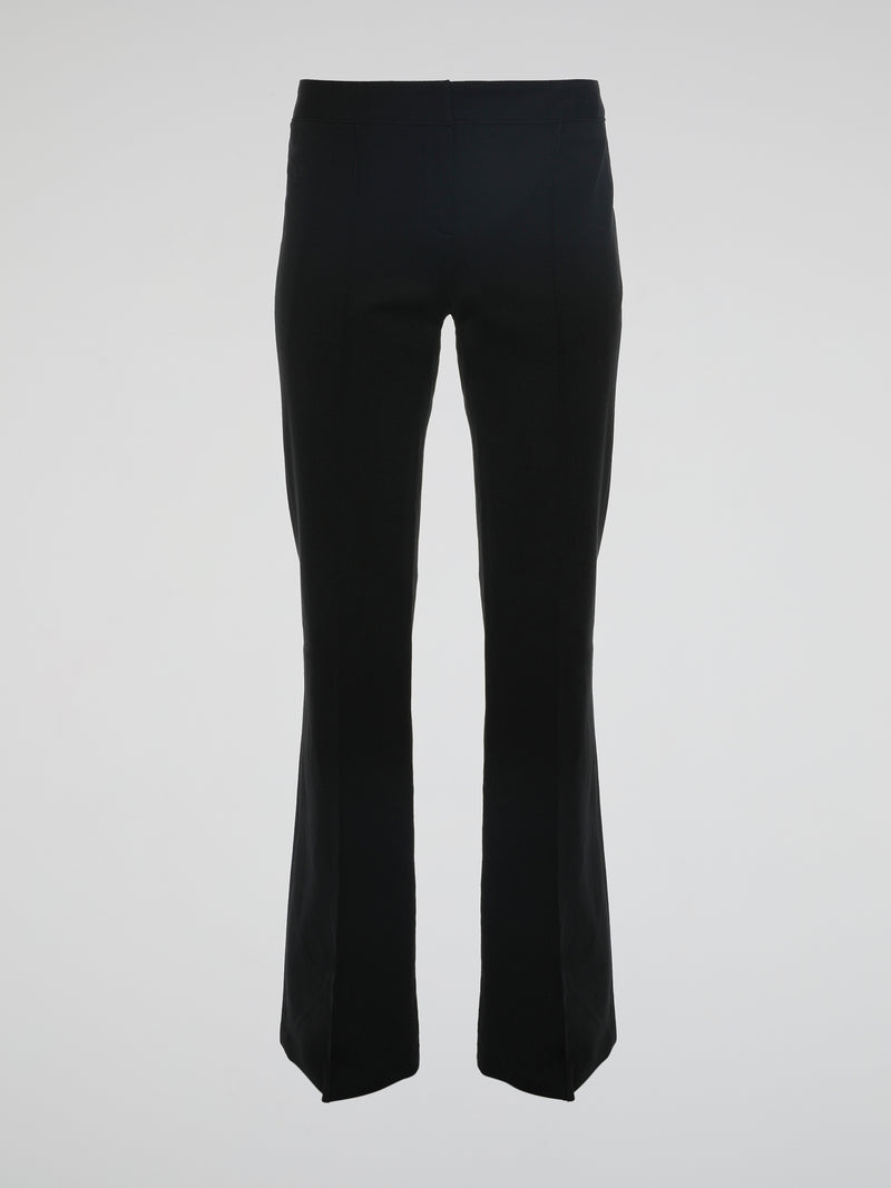 Step into the world of effortless glamour with these Black Flared Trousers by Roberto Cavalli. Crafted with meticulous precision, these trousers boast a striking silhouette that elegantly skims the figure, accentuating every curve. From the office to a night out, these trousers are a timeless wardrobe staple designed to make a bold fashion statement.