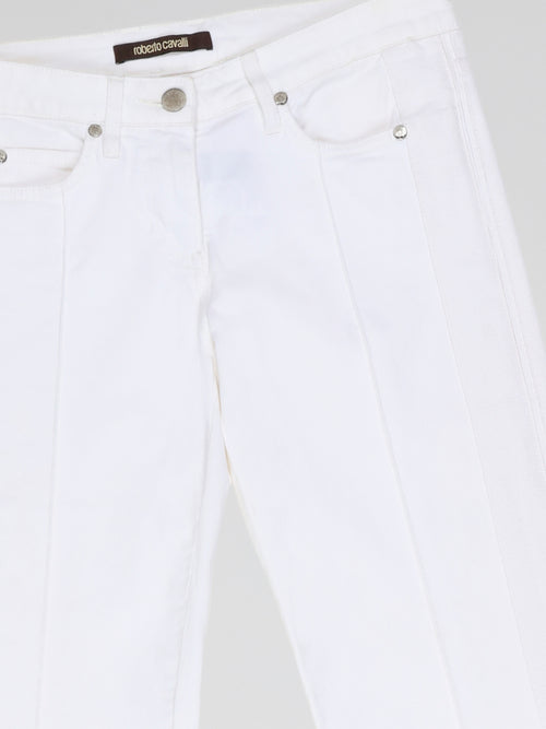 Step into fashion-forward elegance with these White Flared Jeans from renowned designer Roberto Cavalli. Crafted with meticulous attention to detail, these jeans feature a flattering high waistline and a mesmerizing flared silhouette that effortlessly elongates your legs. The pure white hue adds a touch of sophistication, making them the perfect statement piece for any occasion.