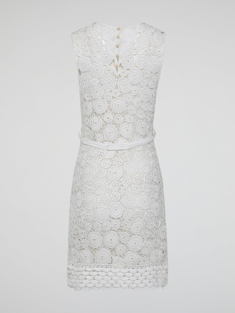 Step into the world of exquisite elegance with this captivating White Crochet Dress by Roberto Cavalli. Crafted with meticulous attention to detail, this dress channels the essence of femininity, showcasing delicate crochet patterns that gracefully embrace your silhouette. Whether you're attending a garden soiree or a beachfront dinner, this dress effortlessly combines timeless charm with modern flair, making you the epitome of effortless beauty.