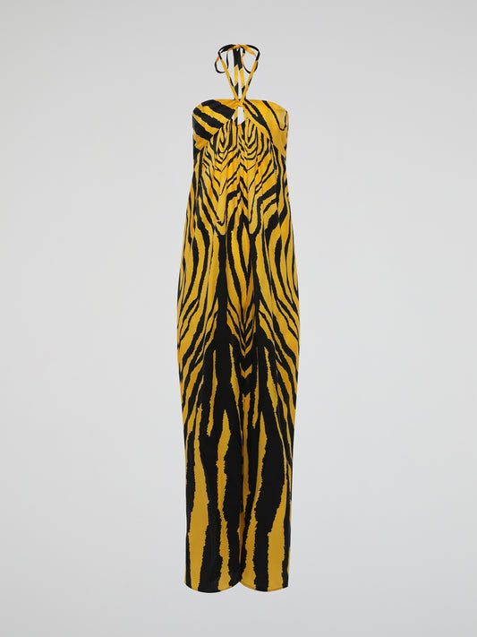 Unleash your wild side with the Animal Print Halter Neck Jumpsuit by Roberto Cavalli. This fierce and daring ensemble embraces the untamed spirit of the jungle, featuring a striking leopard print that demands attention. With its seductive halter neck and flattering silhouette, this jumpsuit is the perfect choice for those who aren't afraid to make a fashion statement.