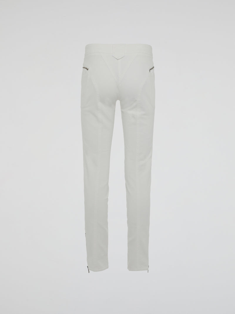 Introducing the epitome of style and sophistication - the White Zipper Detailed Trousers by Roberto Cavalli. These exquisite trousers blend modern minimalism with edgy details, boasting a sleek white hue that exudes elegance. The alluring zipper accents strategically placed throughout add a touch of rebellious charm, making these trousers a true fashion statement.