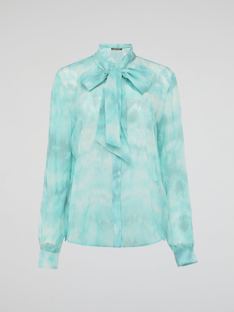 Embrace a vibrant and eco-friendly fashion statement with our Green Tie Dye Blouse by Roberto Cavalli. Crafted with exquisite attention to detail, this unique piece seamlessly combines the timeless elegance of a blouse with the bold and playful allure of tie-dye. Whether you're strolling through a music festival or elevating your everyday style, this blouse promises to make a head-turning statement, while embracing sustainable fashion.