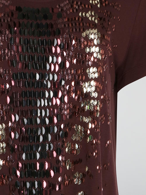 Step out in style with this stunning Burgundy Sequin Embroidered T-Shirt Dress by Roberto Cavalli. The intricate sequin detailing adds a touch of glamour, while the relaxed t-shirt silhouette ensures comfort and ease of wear. Perfect for a night out or special event, this dress is sure to turn heads and make a statement wherever you go.