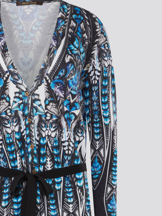 Step out in style with the Roberto Cavalli Printed Tie-Front Cardigan - a chic and sophisticated addition to any outfit. The luxurious fabric and intricate print combine to create a truly eye-catching piece that will effortlessly elevate your wardrobe. Whether paired with jeans for a casual look or layered over a dress for a night out, this cardigan is sure to become a staple in your closet.