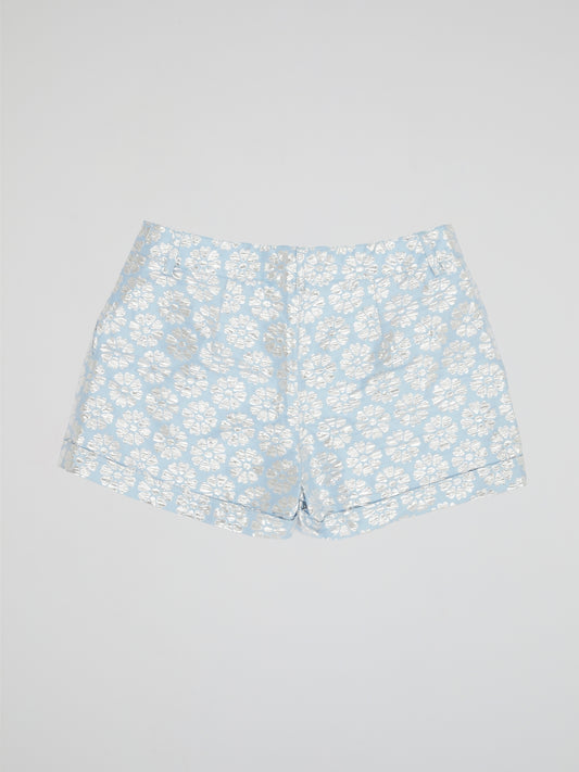 Transport yourself to a whimsical garden with these Blue Floral Print Shorts by Parosh. Made from luxurious fabric, these shorts feature a vibrant blue hue adorned with intricate floral designs for a statement-making look. Perfect for exploring the city or lounging in the sun, these shorts are a must-have addition to your wardrobe.