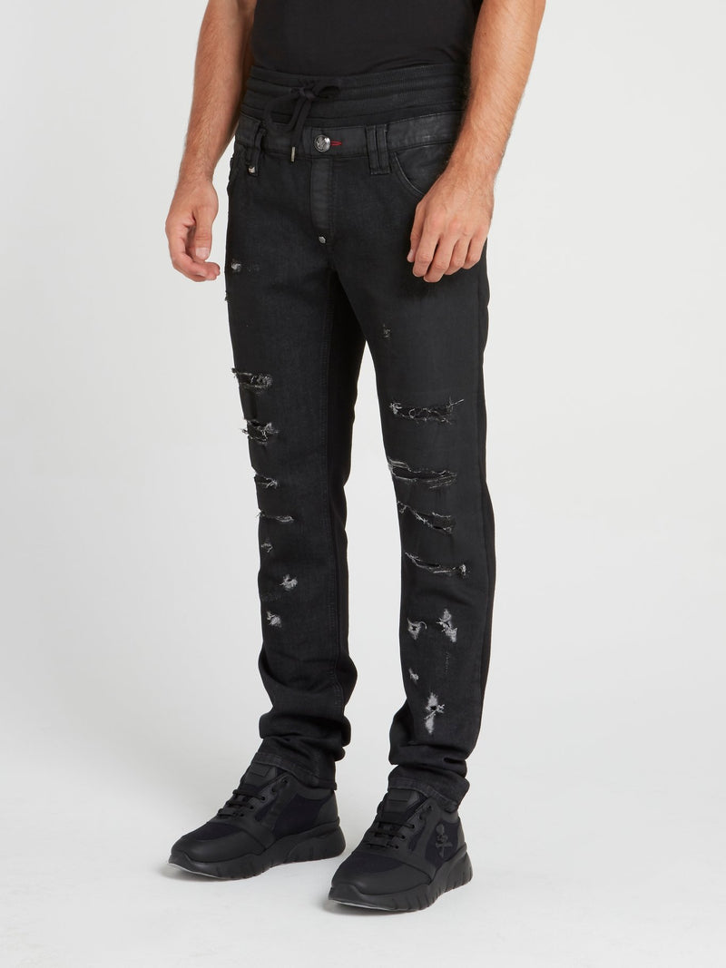 Черные джинсы на шнуровке с рваной отделкой