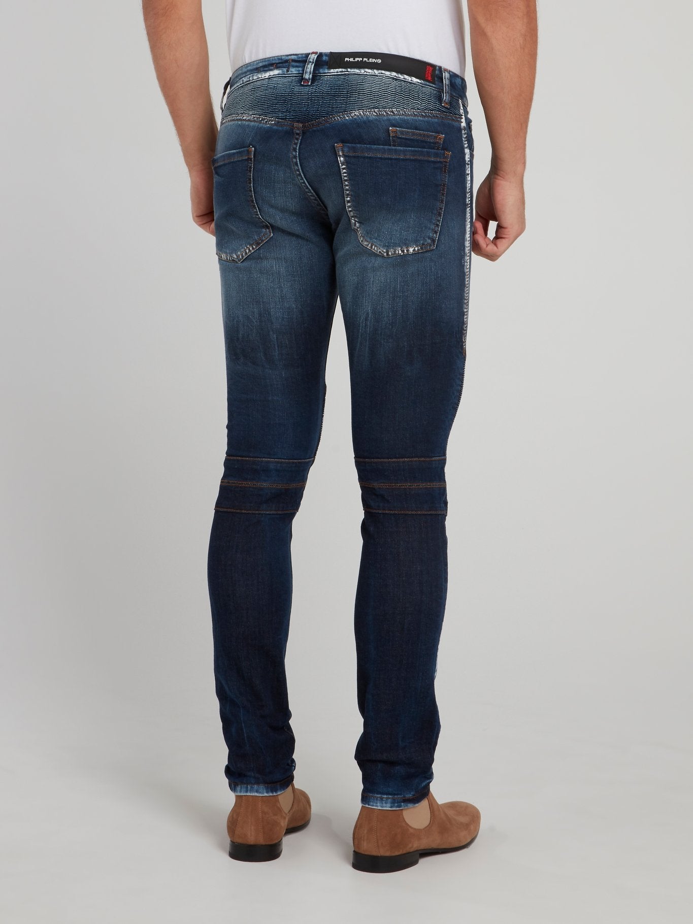 Темно-синие узкие джинсы с рваной отделкой