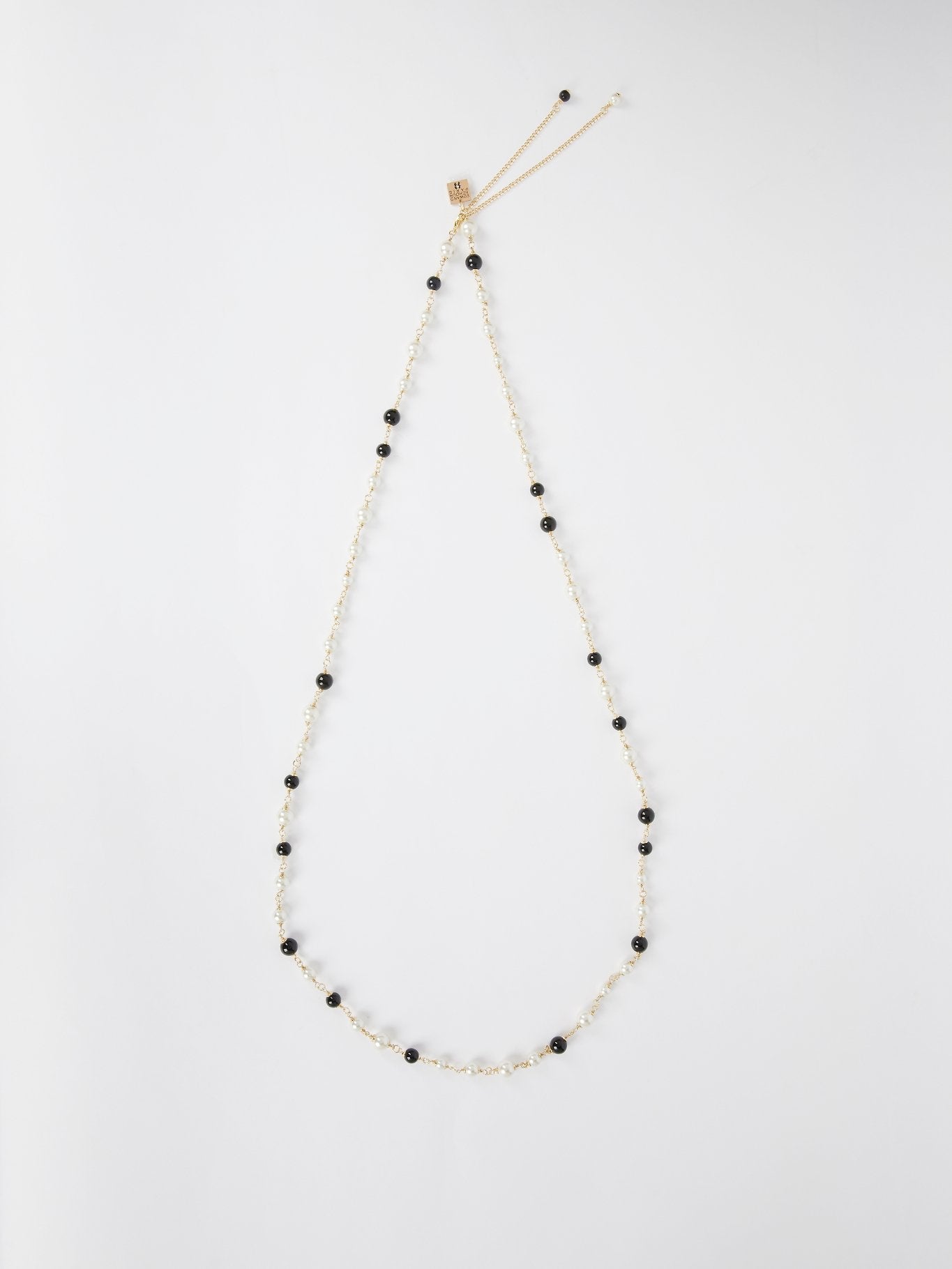 Ожерелье с белыми и черными жемчужинами